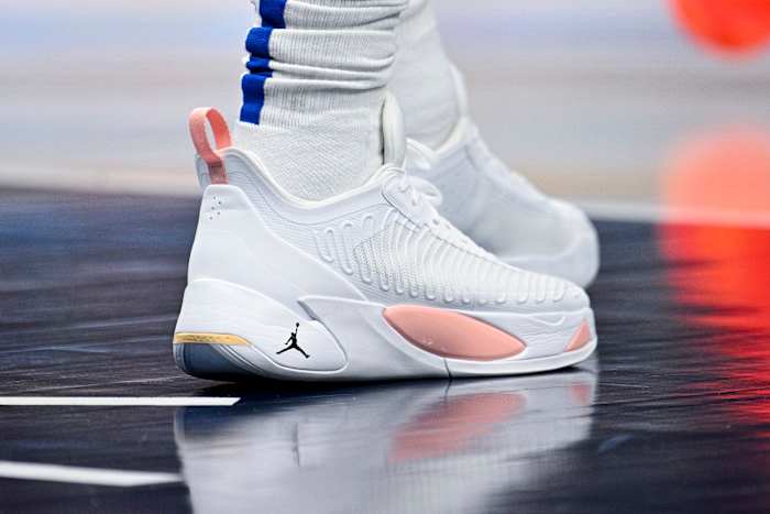 View of Luka Doncic's white and pink shoes.